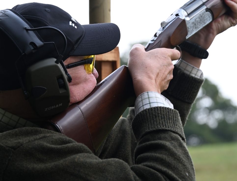 Clay Shoot Man holding a Shotgun