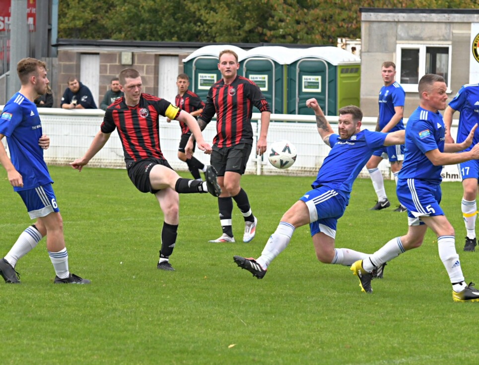 The Evesham branches of Tesco (in red and black) and Morrisons (in blue) play each other in their annual Retail Challenge Cup