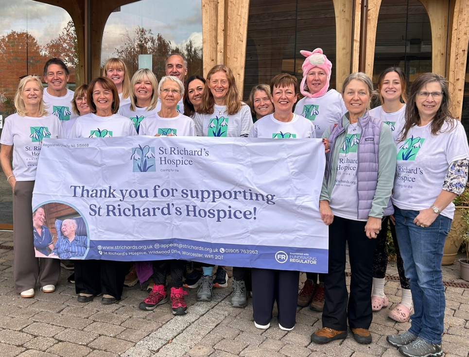 Charity trekkers outside St Richard's Hospice ready to embark on Great Wall of China challenge